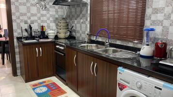 Family Apartment, Balcony, City View | Private kitchen | Fridge, microwave, oven, stovetop