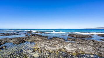 On the beach, sun loungers, beach towels