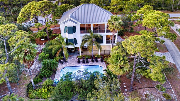 A two-story house with a large front porch, a swimming pool, and a view of the ocean. - Prince of Tides - 6 BEDROOM with POOL+ELEVATOR - SHORT WALK TO BEACH (Eastpoint)