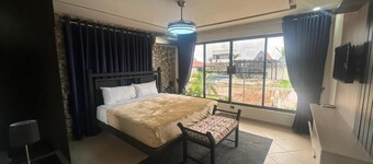 First floor room with small living room and kitchenette