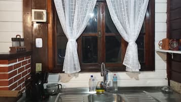 Fridge, stovetop, coffee/tea maker, cookware/dishes/utensils