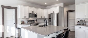 New Spacious Home with 3 Car Garage, Private Backyard, close to Downtown