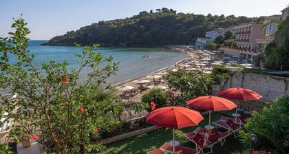 Apartment below with parking and private beach.