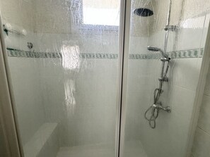 Shower, towels, soap, toilet paper