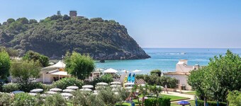 Apartment in portion of villa with solarium and beach.