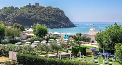 Apartment in portion of villa with solarium and beach.