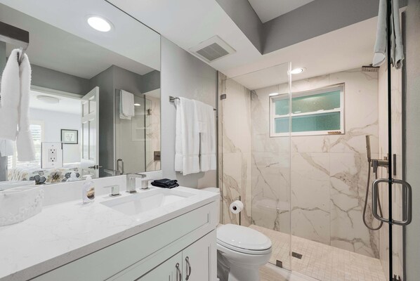 Shower, hair dryer, towels, shampoo