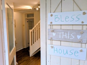 A staircase leading to a room with a door. There are signs on the wall that read 'Bless This House.' - Theatre Severn Town House, Parking & Quarry Views (Shropshire)