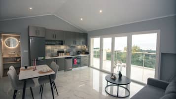 Luxury Apartment, Balcony, Ocean View | Living area | 40-inch Smart TV with cable channels, Netflix, streaming services