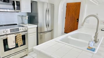Fridge, microwave, stovetop, coffee/tea maker