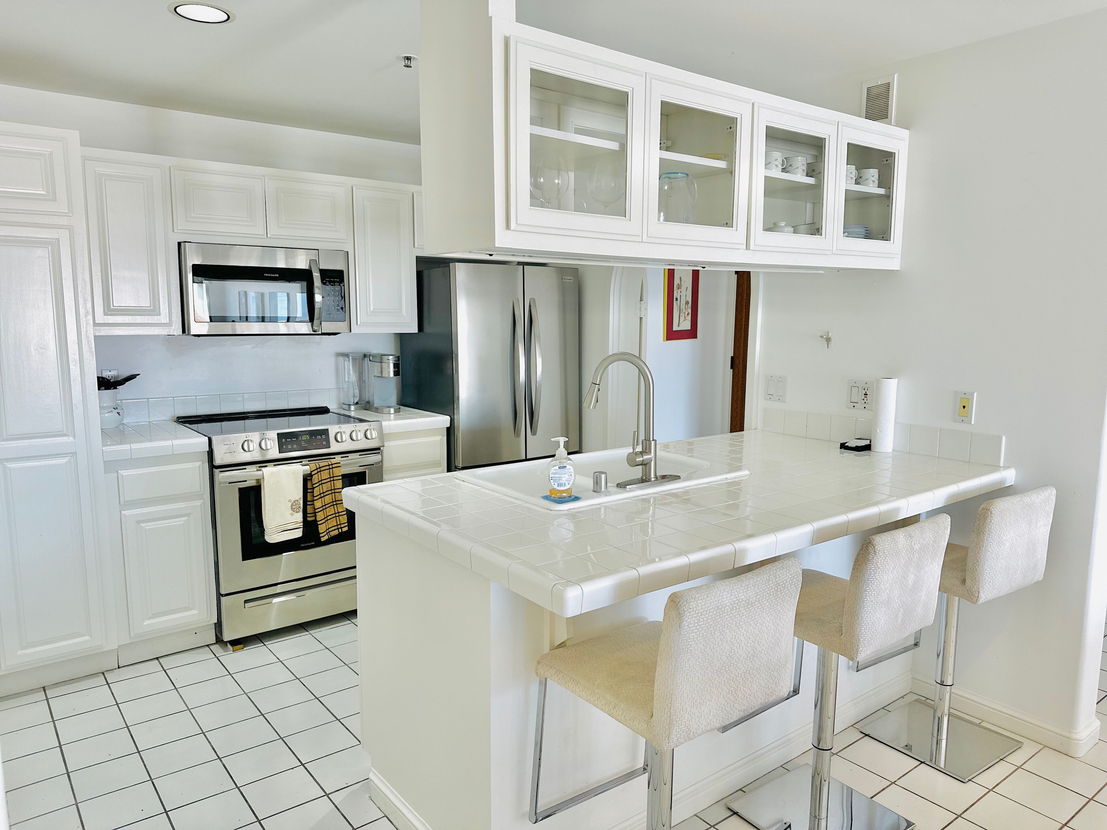 Fridge, microwave, stovetop, coffee/tea maker