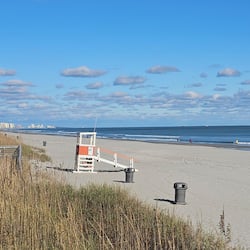 On the beach, sun-loungers, beach towels