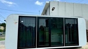 A modern, single-story building with a flat roof and large windows. - Rincon Sunset Studio (Rincon)