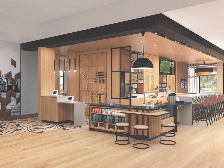 Un área de bar moderna con detalles de madera, un conjunto de asientos y vistas a la ciudad.
