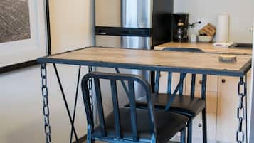 Fridge, microwave, coffee/tea maker, cookware/dishes/utensils