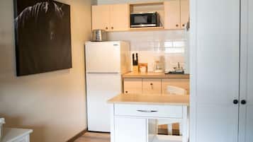 Fridge, microwave, coffee/tea maker, cookware/dishes/utensils