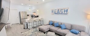 Townhome, Multiple Beds, Kitchen, Garden View (Villas de Laguna 2) | Living area | 75-inch flat-screen TV with digital channels - Villas de Laguna 2 (South Padre Island)