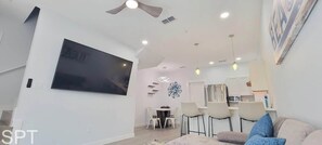 Townhome, Multiple Beds, Kitchen, Garden View (Villas de Laguna 2) | Living area | 75-inch flat-screen TV with digital channels - Villas de Laguna 2 (South Padre Island)