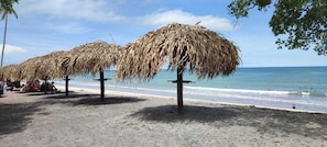 Beach nearby, white sand, beach shuttle, beach umbrellas