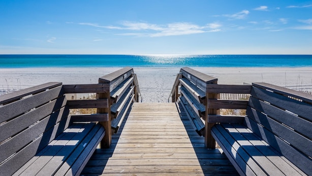 A wooden boardwalk leading to a beach with a clear blue sky. - Beach Resort 514 (Miramar Beach)