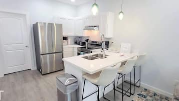 Condo, Multiple Beds, Kitchen, Garden View (Villas de Laguna 3) | Private kitchen | Fridge, microwave, oven, stovetop