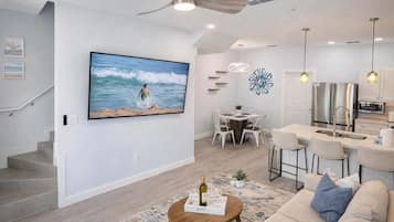 Condo, Multiple Beds, Kitchen, Garden View (Villas de Laguna 4) | Living area | 75-inch flat-screen TV with digital channels