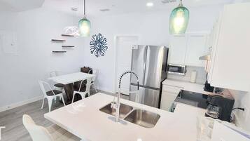 Condo, Multiple Beds, Kitchen, Garden View (Villas de Laguna 4) | Private kitchen | Fridge, microwave, oven, stovetop