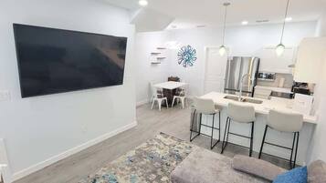 Condo, Multiple Beds, Kitchen, Garden View (Villas de Laguna 4) | Living area | 75-inch flat-screen TV with digital channels