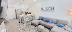 Condo, Multiple Beds, Kitchen, Garden View (Villas de Laguna 4) | Living area | 75-inch flat-screen TV with digital channels