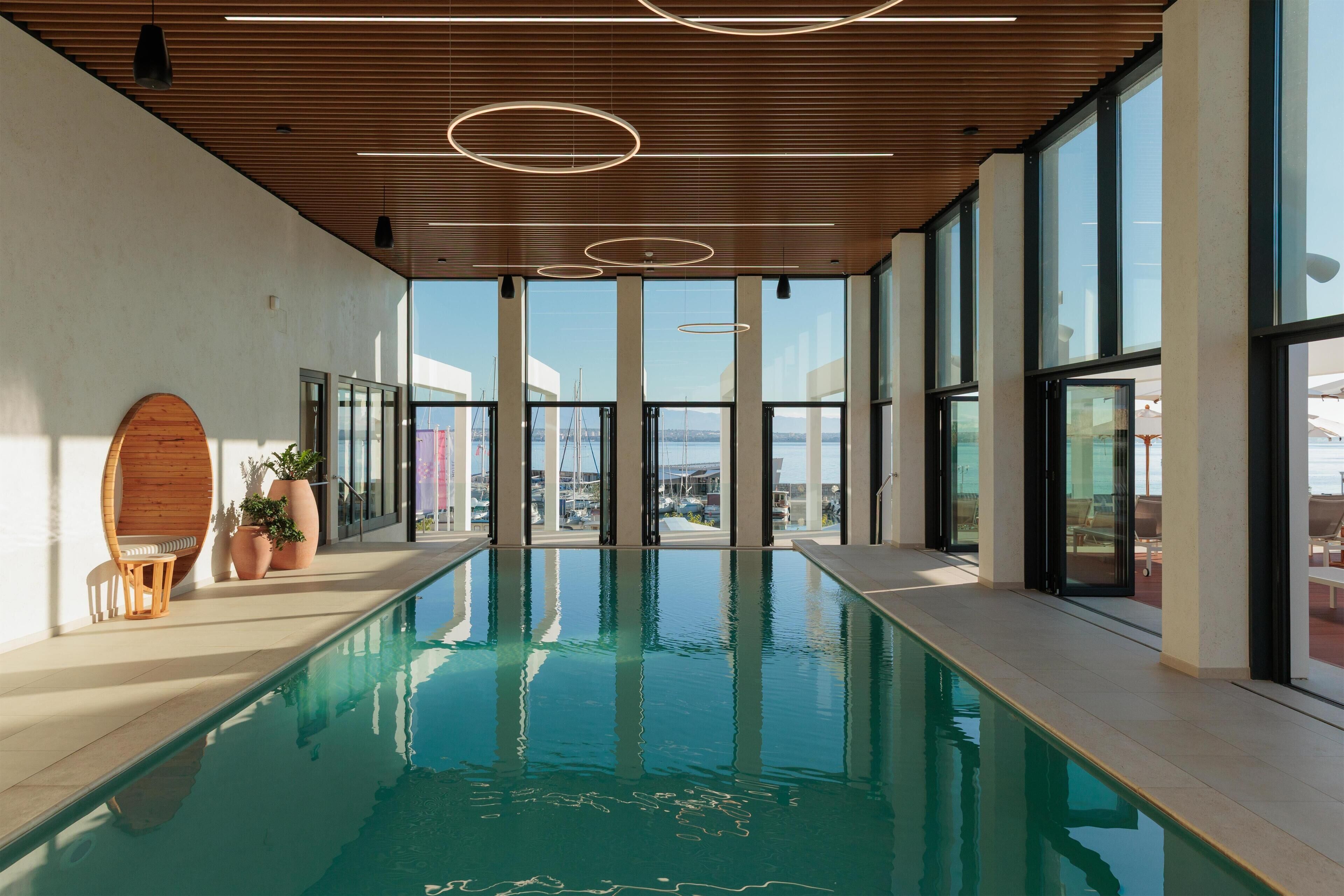 Indoor pool, outdoor pool, pool umbrellas, pool loungers
