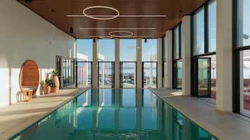 Indoor pool, outdoor pool, pool umbrellas, pool loungers