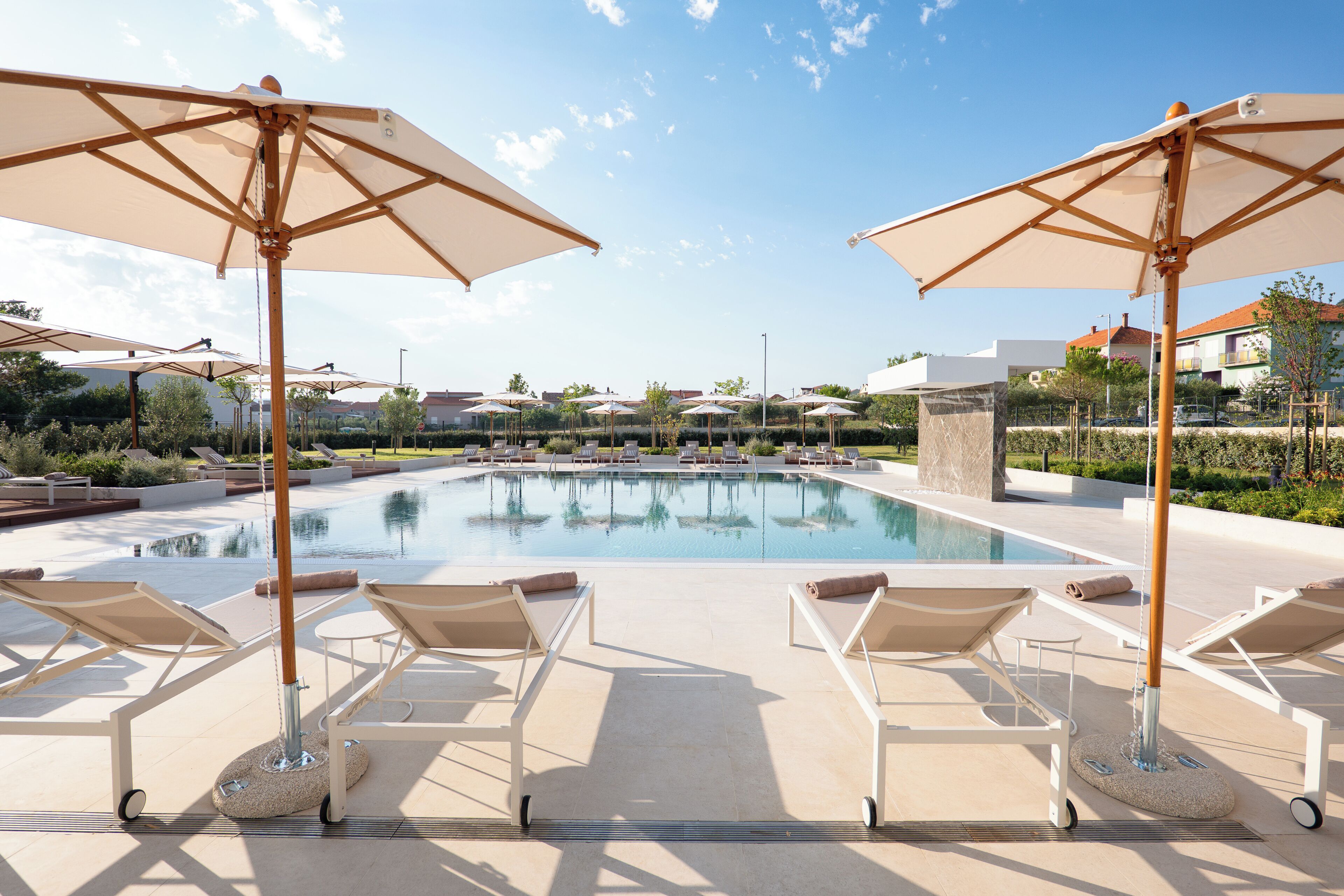 Indoor pool, outdoor pool, pool umbrellas, pool loungers