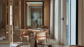 A modern dining area with wooden furniture and large windows. - Hotel Preko Ugljan Island, Curio Collection By Hilton (Preko)