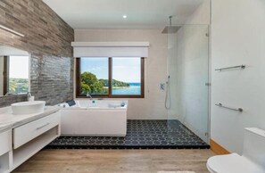 Shower, hair dryer, towels, toilet paper