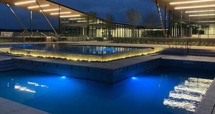 Luxury 2-Story Condo • Hot Tub • Gym • Pool • Airport