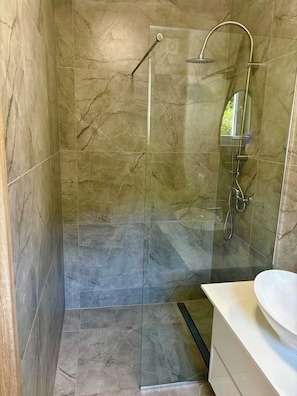 Shower, towels, soap, toilet paper