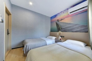 A hotel room with two beds, a painting of a sunset over a pier, and an air conditioning unit. - Banyan Tree Villa Hotel (Semporna)