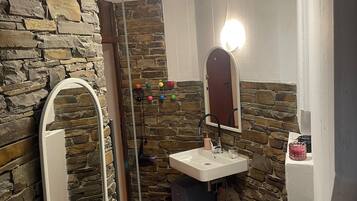 Shower, towels, soap, toilet paper