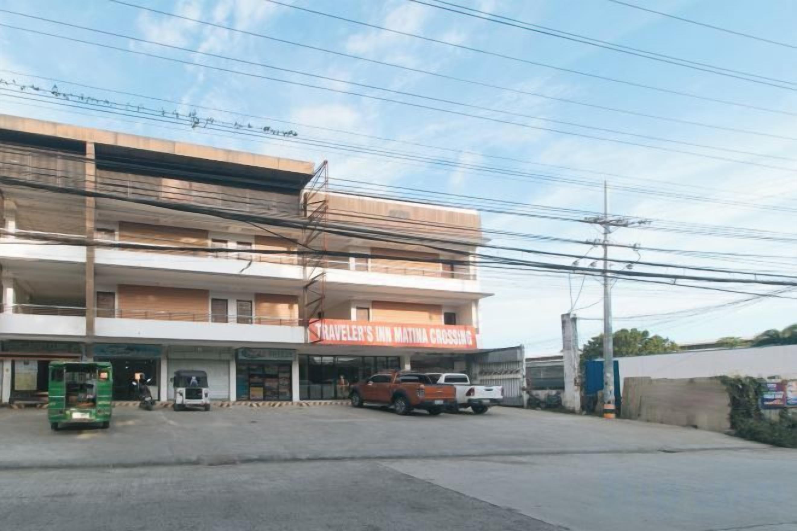 A multi-story building with a sign for 'Traveler's Inn Matmata Crossroads.'