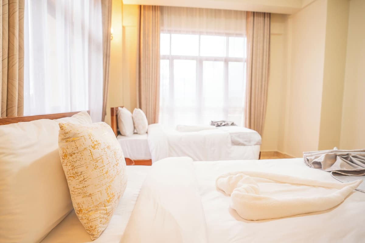 Room, 3 Twin Beds, City View | Desk, laptop workspace, free WiFi, bed sheets
