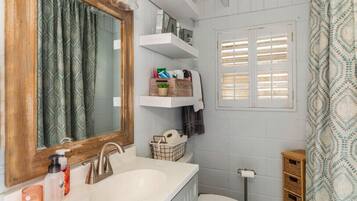 Shower, hair dryer, towels, toilet paper