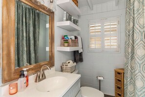 Shower, hair dryer, towels, toilet paper