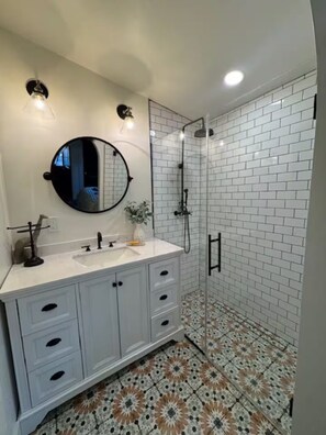 Shower, hair dryer, towels, soap
