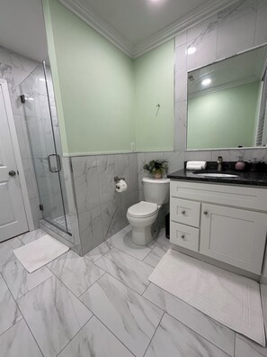 Shower, hair dryer, towels, soap