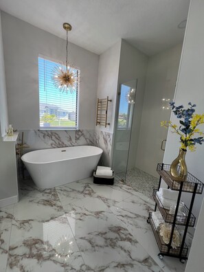 Shower, eco-friendly toiletries, hair dryer, towels