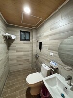 Shower, hair dryer, slippers, towels