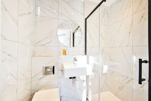 Shower, hair dryer, towels, soap