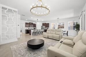 Premium House | Living area | Flat-screen TV, books - Disney Vacation Home Solterra (Davenport)
