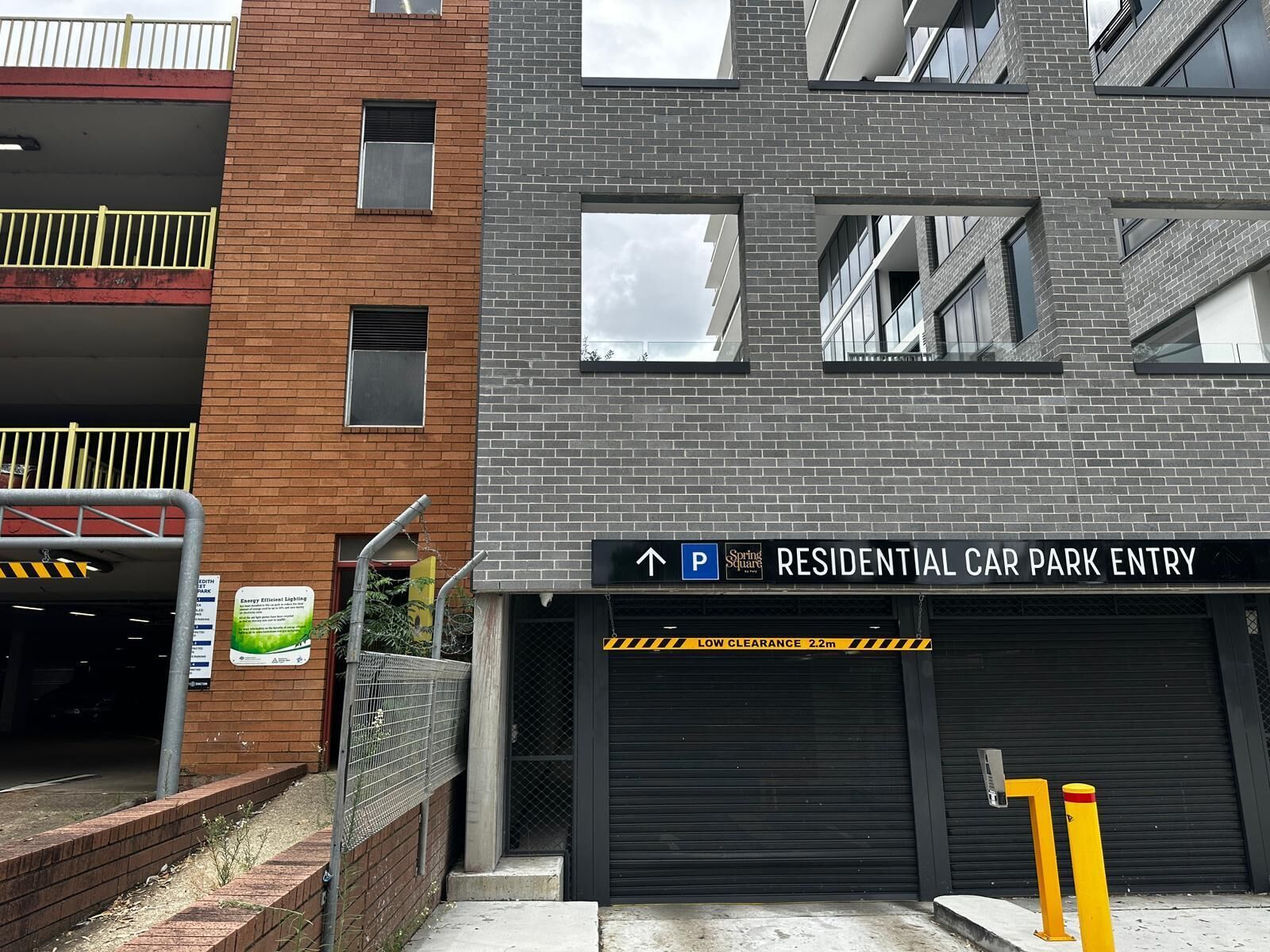 A residential car park with a sign indicating the entry.