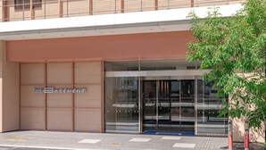 A modern building entrance with a sign reading "THE BASEMENT." - THE BASEMENT HOTEL Osaka Honmachi  (Osaka)